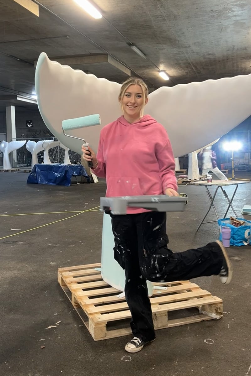 Artist Becky Dodd starting to paint the Tail that Bournemouth Water are sponsoring