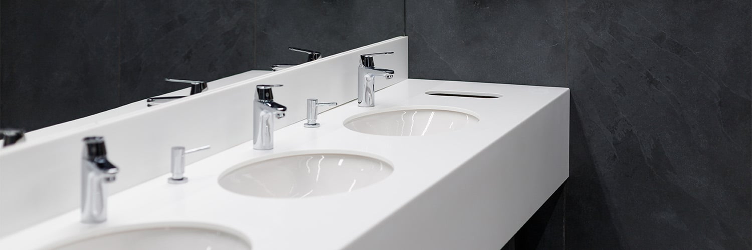 Row of sinks within office bathroom